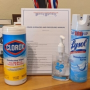 Picture of Bridge 2 Sports COVID-19 policy with Lysol spray, hand sanitizer and cleaning wipes