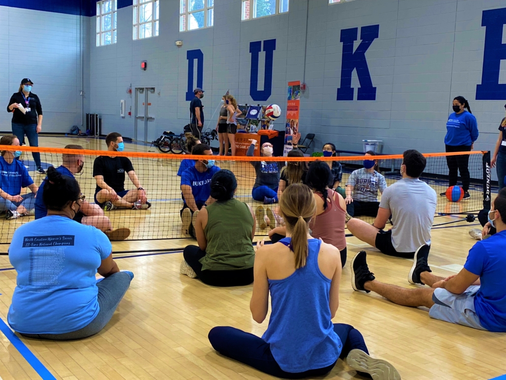 duke college students play sitting volleyball